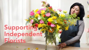 Florist arranging colorful bouquet with text Supporting Independent Florists